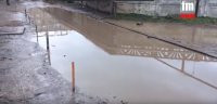 Новости » Общество: В Керчи уже месяц никто не может решить проблему с болотом в жилом дворе